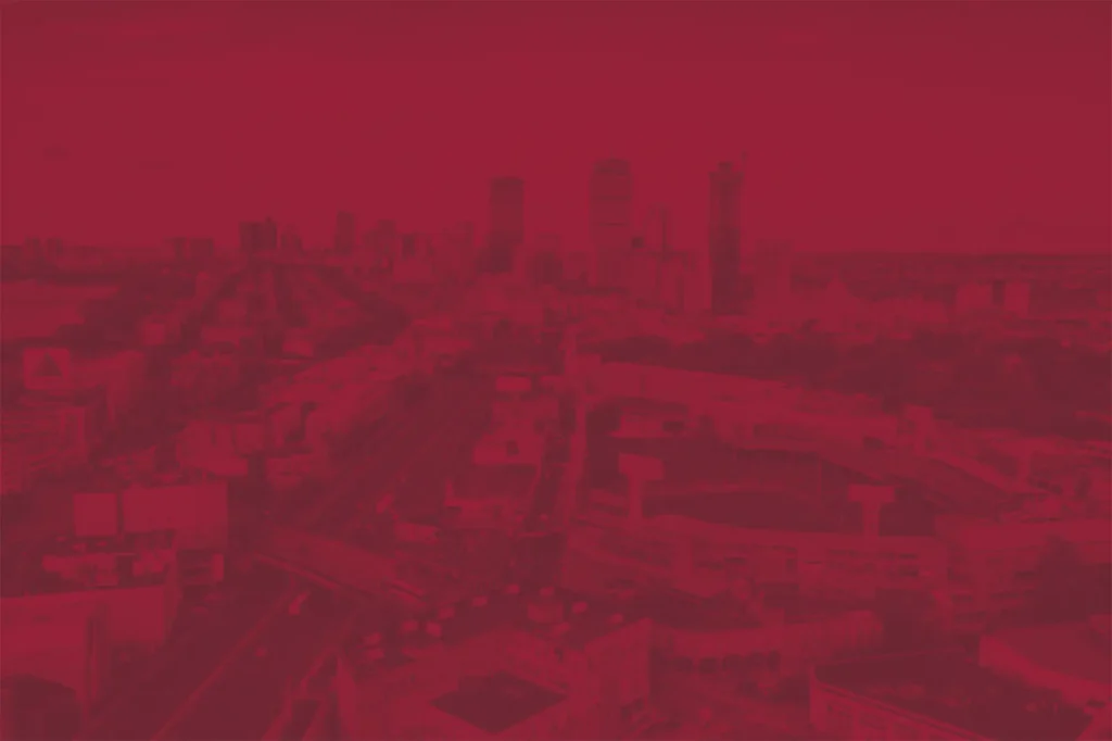 BC High cityscape red tinted background image
