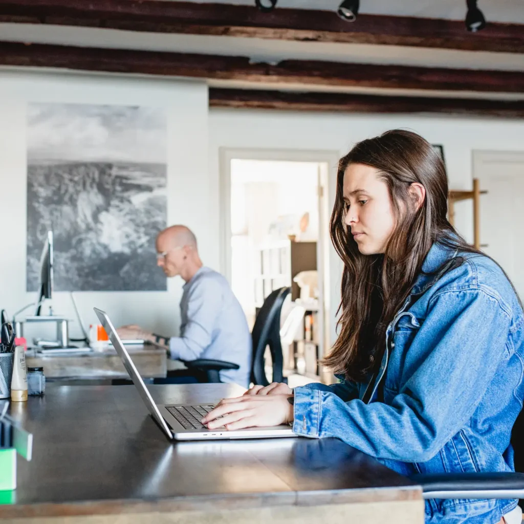 Two designers working at a graphic design studio