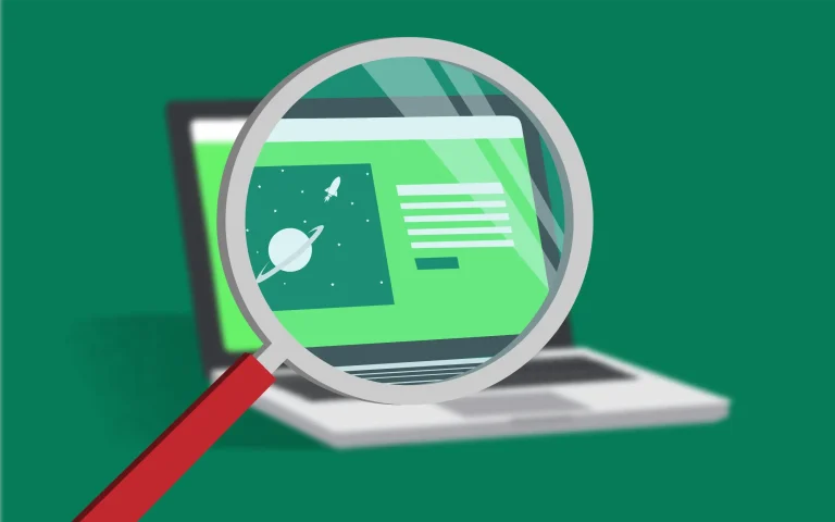 A magnifying glass inspects a website on a laptop